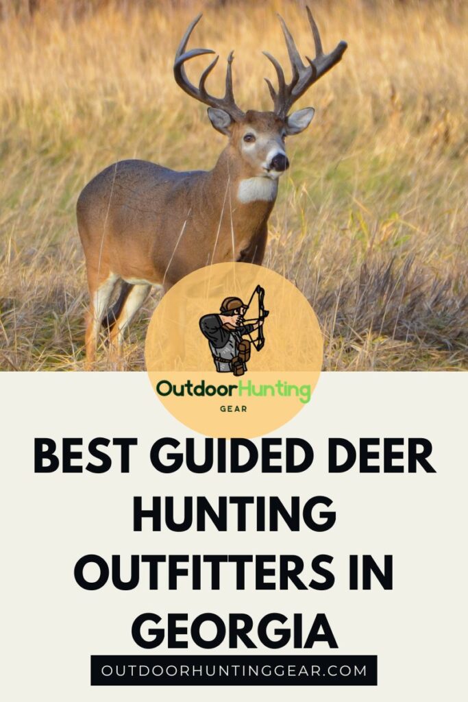 A group of hunters standing in a field, with a guide pointing out a deer in the distance.