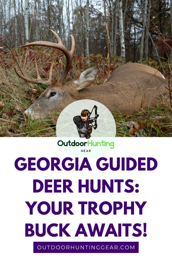 A hunter standing in a field, proudly holding up a large deer buck.